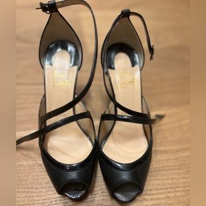 Christian Louboutin heels in US size 7 size with patent red soles